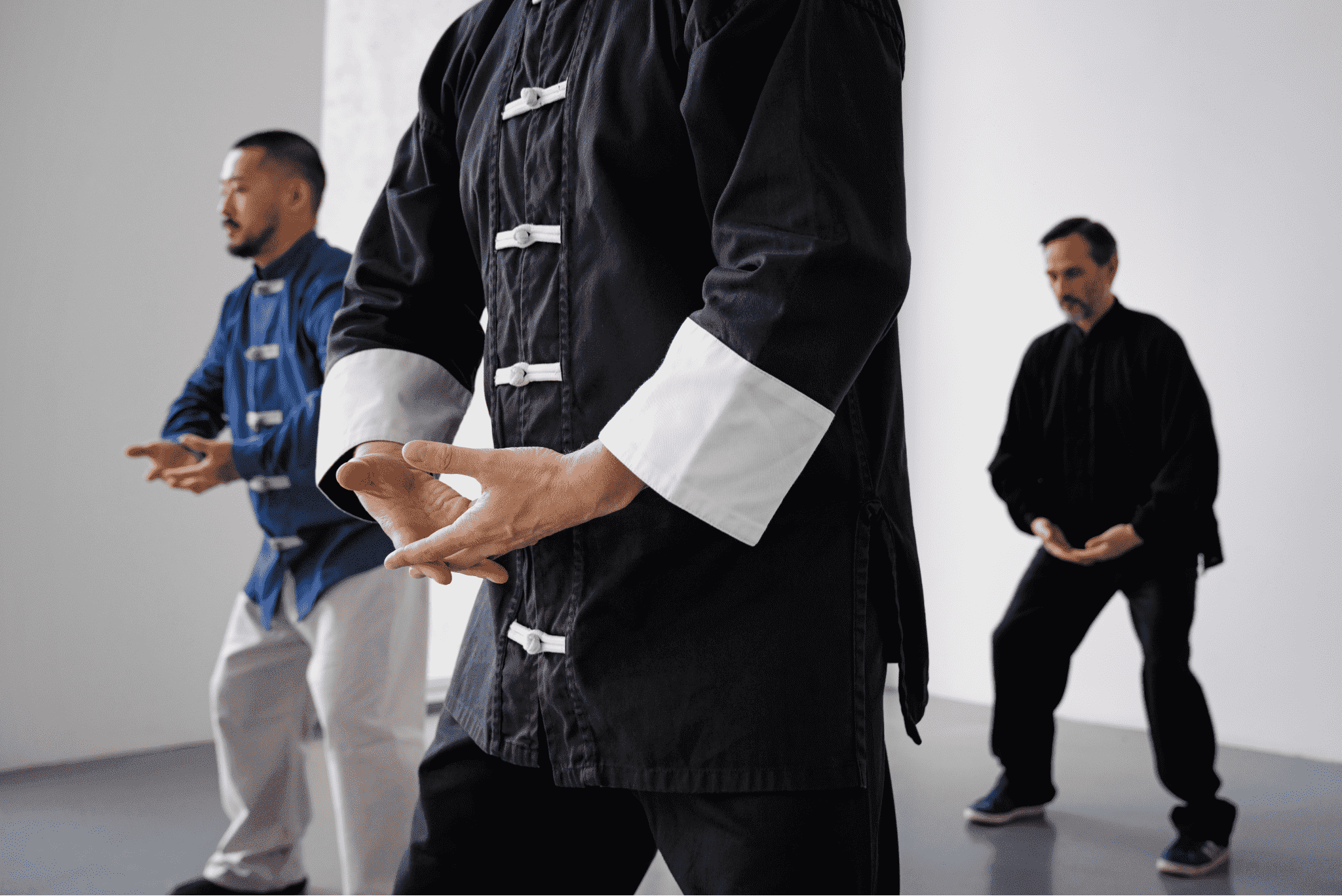 side-view-people-practicing-tai-chi-indoors
