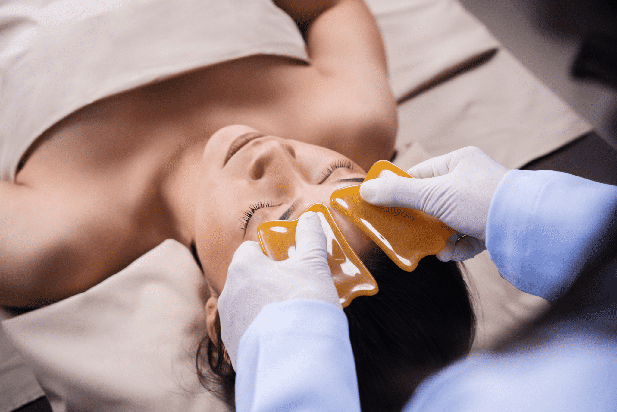woman-receiving-traditional-guasa-face-therapy